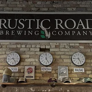 clocks on a brick wall