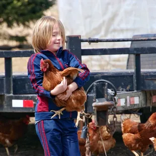 This girl caught a chicken
