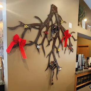 a bar counter with a wine rack and wine glasses on it