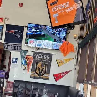 a bar with a large screen tv