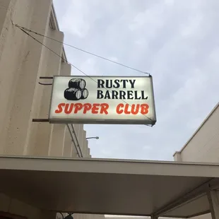 sign for rusty barrell supper club