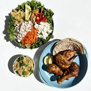 a plate of food and a bowl of salad