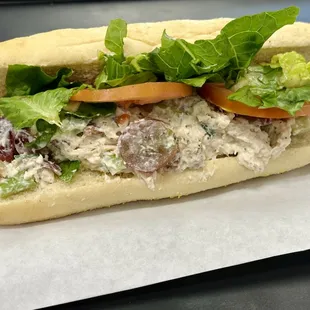 Chicken Salad Sandwich - Premium White Meat mixed with mayo, grapes, pecans, celery, and green onions.