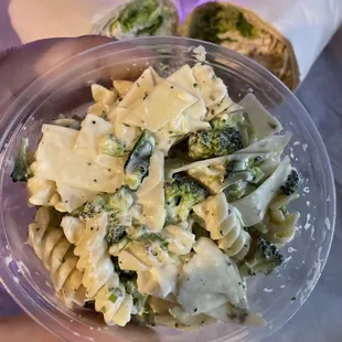 a bowl of pasta and broccoli