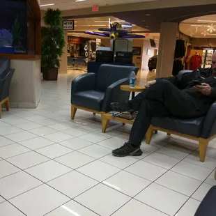 There is a massive waiting area here. It has a snackbar, movie area, tv, wifi, all sorts of stuff. Wow!