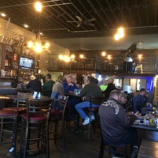 Swanky place with balcony seating, complete with antler chandeliers?