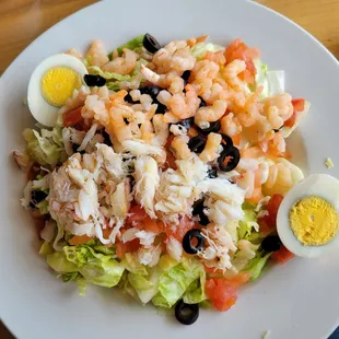 a plate of salad with hard boiled eggs