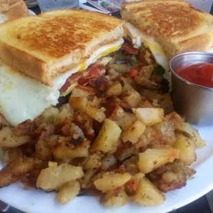 Overloaded Breakfast Sandwich with breakfast potatoes. Delicious!