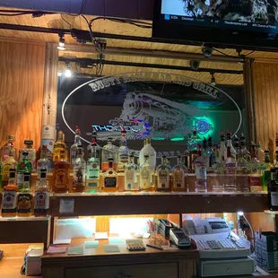 a bar with a lot of liquor bottles