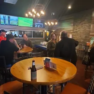 a group of people at a bar