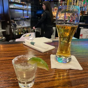 a glass of beer and a lime slice
