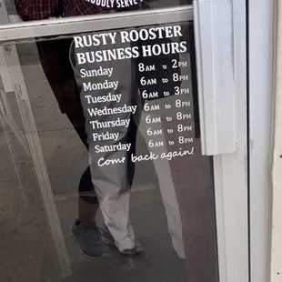 a man standing in front of a window