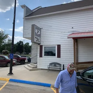 a man standing in front of a building