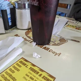a glass of soda on a table