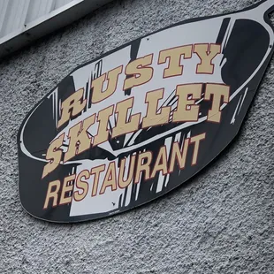 a sign on the side of a restaurant