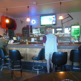Business end of the house; Note the silver purse hooks under the bar