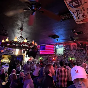 a crowd of people in a bar