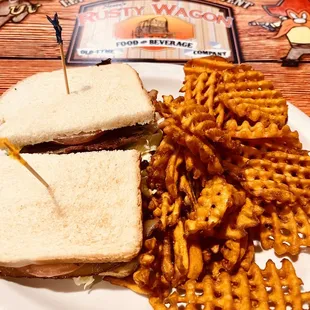 Bacon Lettuce Tomato (BLT) sandwich with sweet potato waffle fries.