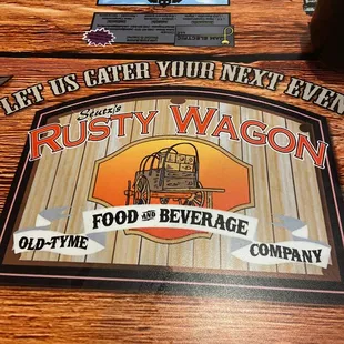 a sign for rusty wagon