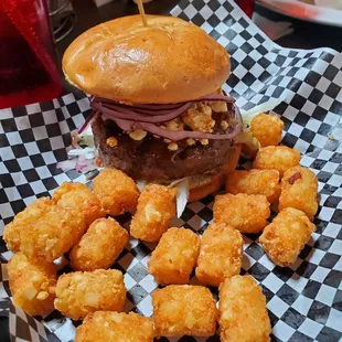 Black and blue burger with tater tots
