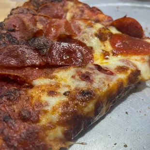 a slice of pepperoni pizza