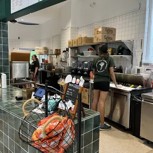 a woman working in the kitchen