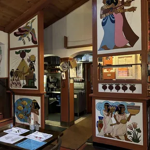 A server station surrounded by artwork