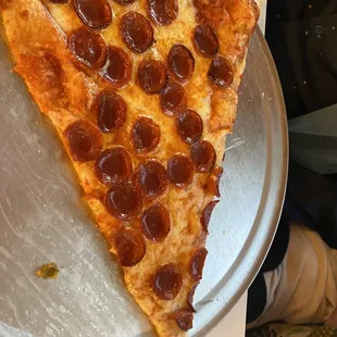 One slice of pepperoni pizza - NY style - think crust and full of pepperoni!  Very yummy!