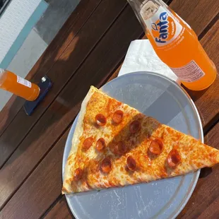 Pepperoni pizza and a Fanta.