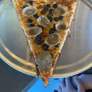 Black olive and sausage.  Crispy crust and edges all around.