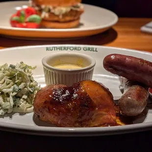Local sausages and chicken thigh with coleslaw