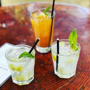 two cocktails on a table