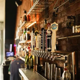 beer taps lined up on the bar
