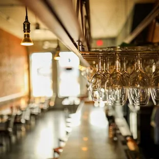 wine glasses hanging from the ceiling