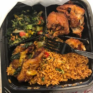 Main course plate with jollof rice, plantains, fish, and greens