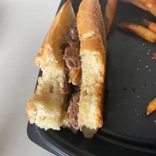 a steak sandwich and french fries