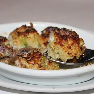 The Mushrooms Stuffed with Crabmeat are broiled &amp; topped with romano cheese.