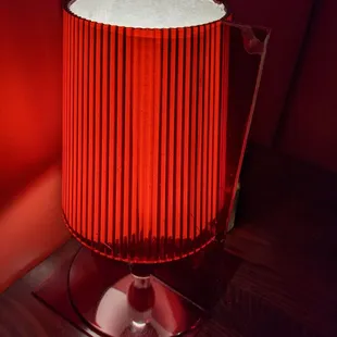 A different colored lamp adorns each table.