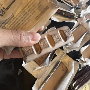 a person holding a package of food