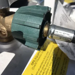 Obvious tool mark on brass fitting and hose