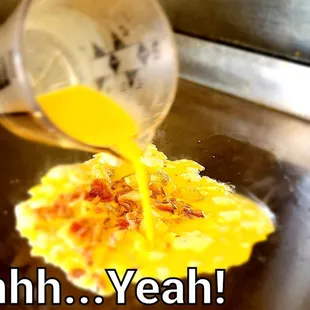 an omelet being poured onto an omelet