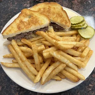 Picture perfect Patty Melt with French Fries! Both were delicious! The meat was seasoned very well!