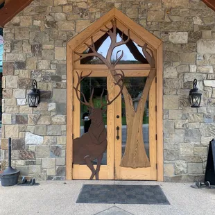 Beautiful art on the door at Ryan&apos;s creek house