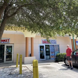 a man standing in front of the store