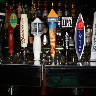 a row of beer taps