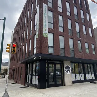 a large brick building on a corner