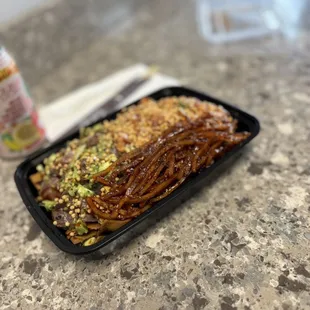 Poke is freshly made, ginger avocado &amp; spicy ahi, and Taegu on a bed of nachos!