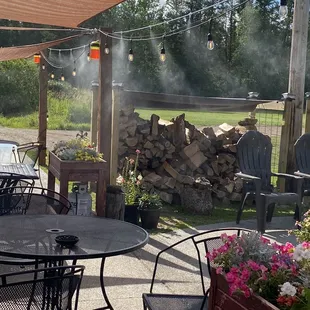 a patio with tables and chairs