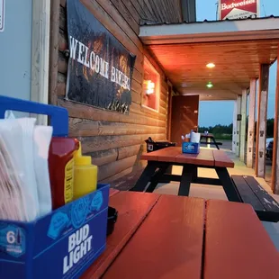 a picnic table with ketchup and condiments