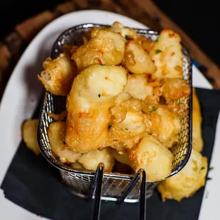 a basket of fried food on a plate